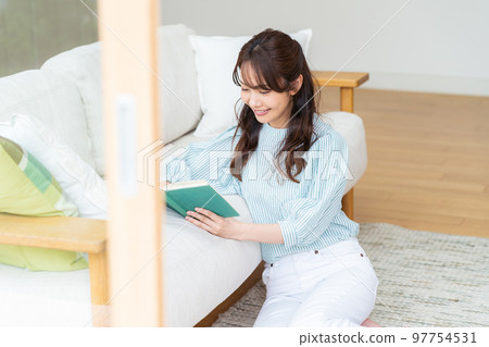 A young woman reading A young woman reading 97754531