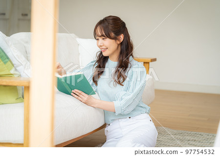A young woman reading A young woman reading 97754532