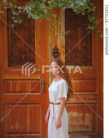 Happy woman tourist on blooming street of Antalya Happy woman tourist on blooming street of Antalya 97755651