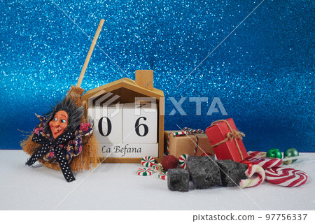 The Befana with sweet coal and candy. Italian Epiphany day tradition. The Befana with sweet coal and candy. Italian Epiphany day tradition. 97756337