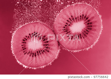Kiwi in water with bubbles. Kiwi underwater Color 2023, viva magenta 97756642