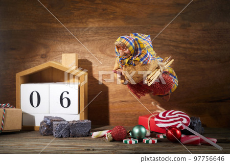 The Befana with sweet coal and candy. Italian Epiphany day tradition. 97756646