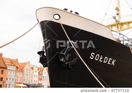 Old town in Gdansk. Famous Soldek ship. Soldek is first ship built in Poland after World War II. The riverside on Granary Island reflection in Moltawa River Cityscap. Ancient crane at dusk. Visit Old town in Gdansk. Famous Soldek ship. Soldek is first ship built in Poland after World War II. The riverside on Granary Island reflection in Moltawa River Cityscap. Ancient crane at dusk. Visit 97757118