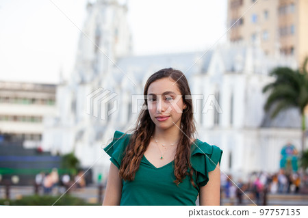 Beautiful tourist girl at the Ortiz Bridge with La Ermita church on background in the city of Cali in Colombia 97757135