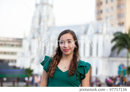 Beautiful tourist girl at the Ortiz Bridge with La Ermita church on background in the city of Cali in Colombia 97757136
