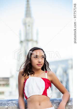 Beautiful tourist girl at the Ortiz Bridge with La Ermita church on background in the city of Cali in Colombia 97757148