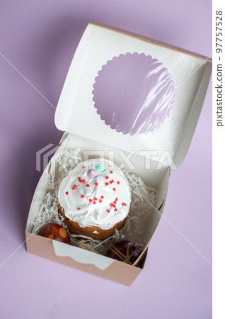 Easter cake kraffin in icing sugar is in a box 97757528