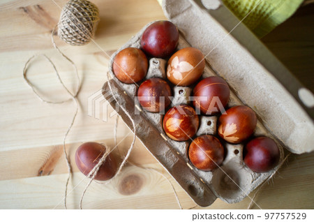 Painted eggs cooked for Easter are in an eco-friendly tray Painted eggs cooked for Easter are in an eco-friendly tray 97757529