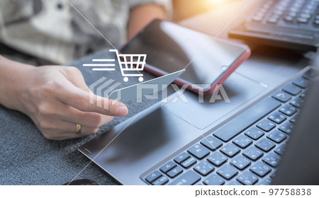 credit card filling in billing information in purchase of laptop computer in ecommerce store. Concept: online payment. Internet accessible money transactions credit card filling in billing information in purchase of laptop computer in ecommerce store. Concept: online payment. Internet accessible money transactions 97758838