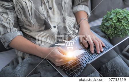 credit card filling in billing information in purchase of laptop computer in ecommerce store. Concept: online payment. Internet accessible money transactions credit card filling in billing information in purchase of laptop computer in ecommerce store. Concept: online payment. Internet accessible money transactions 97758839