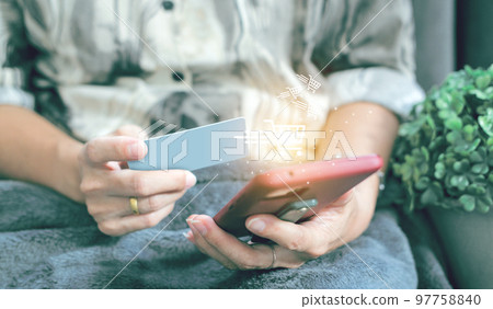 credit card filling in billing information in purchase of laptop computer in ecommerce store. Concept: online payment. Internet accessible money transactions 97758840