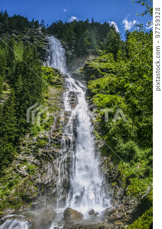 Image of high waterfall during the day 97759328