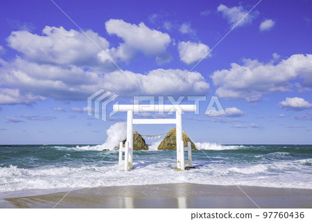 White torii gate and Meotoiwa in Futigaura, Itoshima City, Fukuoka Prefecture 97760436