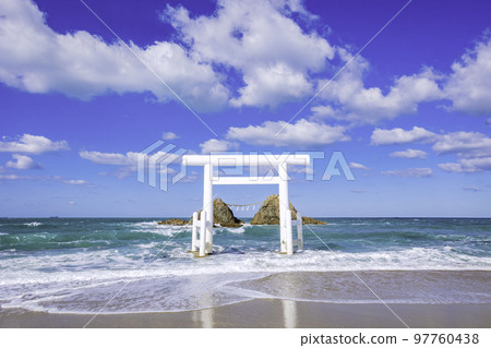 White torii gate and Meotoiwa in Futigaura, Itoshima City, Fukuoka Prefecture 97760438