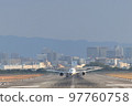 Front view of an airplane about to take off 97760758