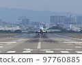 Front view of an airplane taking off from the runway 97760885