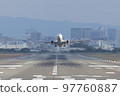 Front view of an airplane taking off from the runway 97760887