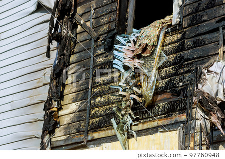 Fire destroyed interior of burned house causing disaster in houses interior 97760948