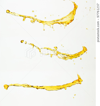 Orange, lemon juice or oil lubricant splash, liquid gold yellow drink drops. Fruit beverage water elements in line form . Fresh splashing and flowing jets, white background isolated freeze motion 97761237