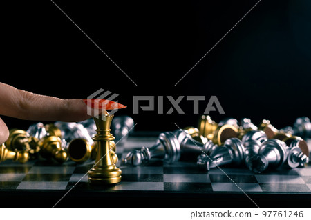 Business woman play queen Chess with close up finger nail. Leader use strategy game to challenge competitor with leadership to move Queen to victory with management team idea fight last stand 97761246