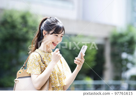 Smartphone young woman search research find smile 97761615