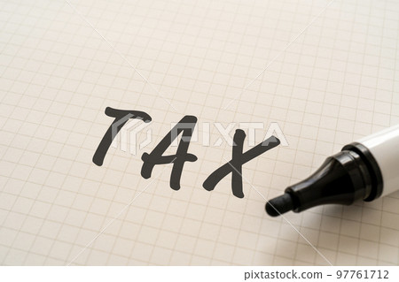 Paper with TAX written on it 97761712
