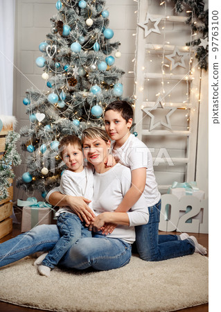 Family enjoying Christmas. Family celebrating christmas together. 97763100