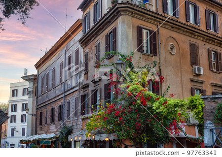 Old Historic Streets in Downtown Rome, Italy. Flowers 97763341