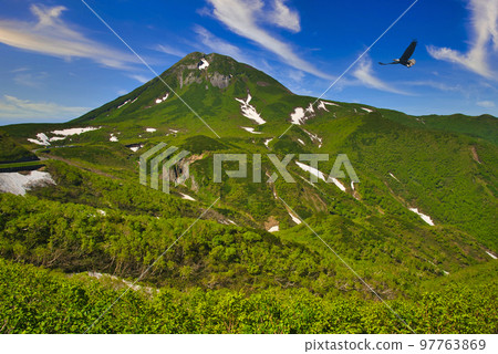 World Heritage Shiretoko Pass Mt. Rausu and remaining snow World Heritage Shiretoko Pass Mt. Rausu and remaining snow 97763869