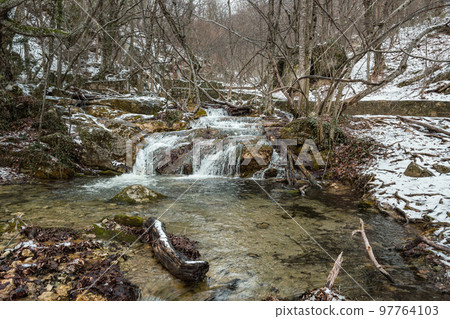 Diferent cascades of Djur-Djur waterfall on Ulu-Uzen river in early spring. Khapkhalskiy canyon in Crimea 97764103