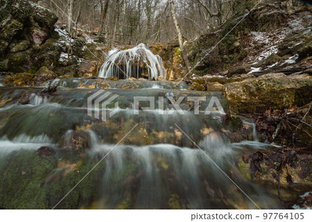 Cascades of Djur-Djur waterfall on Ulu-Uzen river in early spring. Khapkhalskiy canyon in Crimea 97764105