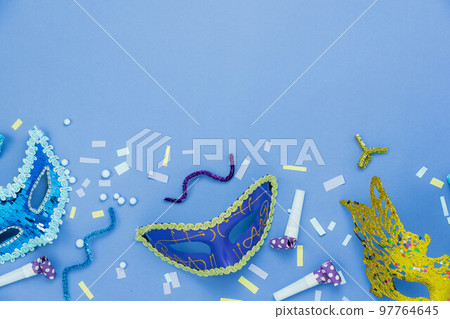 Table top view aerial image of beautiful colorful carnival festival background.Flat lay accessory object the several mask  decor confetti on modern pink paper at home office desk studio.copy space.. 97764645