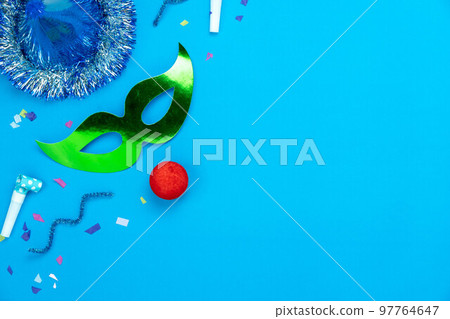 Table top view aerial image of beautiful colorful carnival festival background.Flat lay accessory object the several mask  decor confetti on modern pink paper at home office desk studio.copy space.. 97764647