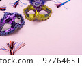 Table top view aerial image of beautiful colorful carnival festival background.Flat lay accessory object the several mask  decor confetti on modern pink paper at home office desk studio.copy space.. 97764651
