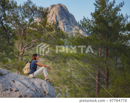woman traveler walking by Lycian Way trail woman traveler walking by Lycian Way trail 97764778