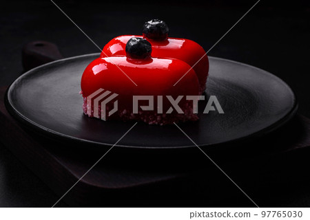 Delicious cheese cakes with red coating made for Valentine's holiday 97765030