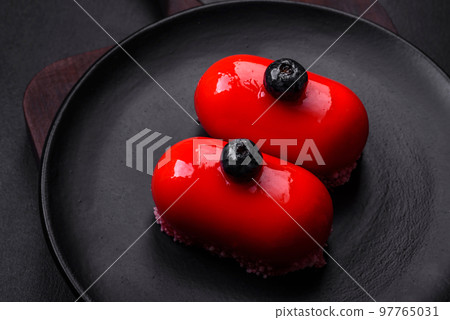 Delicious cheese cakes with red coating made for Valentine's holiday 97765031