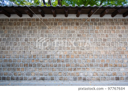 Traditional Korean stone wall boundary with roof Traditional Korean stone wall boundary with roof 97767684