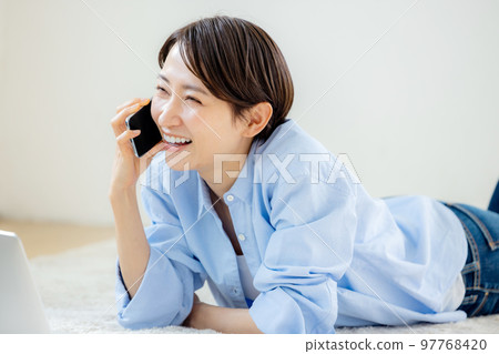 Female smartphone house relaxing Female smartphone house relaxing 97768420