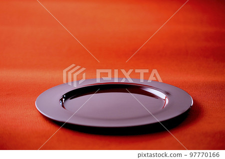 Red lacquerware dish on red chirimen Japanese cloth Image of Japan Red lacquerware dish on red chirimen Japanese cloth Image of Japan 97770166