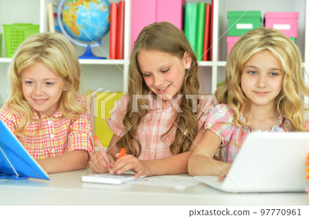 Portrait of girls with laptop on lesson Portrait of girls with laptop on lesson 97770961