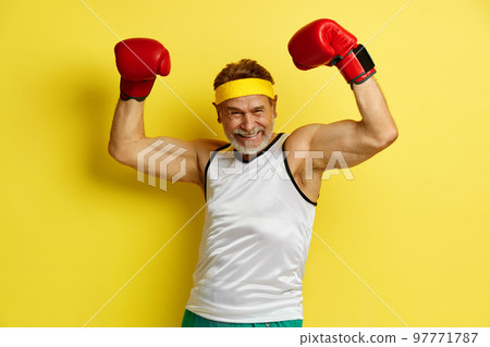 Sport Man Celebrating. Grandfather Demonstrating Power in His Hands Sport Man Celebrating. Grandfather Demonstrating Power in His Hands 97771787