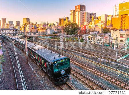 Tokyo cityscape in Japan View of the hotel area in front of Uguisudani station (on the left is the black Yamanote line that left the station) 97771881