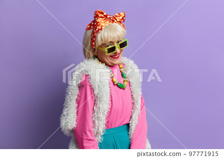 Coquettish Grandmother Posing Studio. Elderly Woman Being In Romantic Mood Coquettish Grandmother Posing Studio. Elderly Woman Being In Romantic Mood 97771915