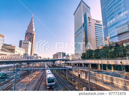 Tokyo cityscape of Japan overlooking the NTT Docomo Yoyogi Building and trains 97771978