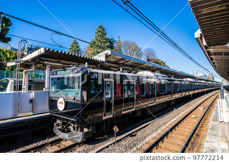 Tokyo cityscape in Japan Black Yamanote Line (rear vehicle) arriving at Nishi-Nippori Station 97772214