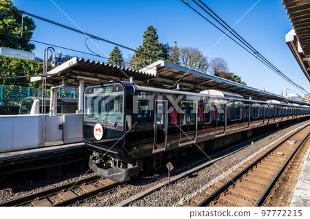 Tokyo cityscape in Japan Black Yamanote Line (rear vehicle) arriving at Nishi-Nippori Station 97772215