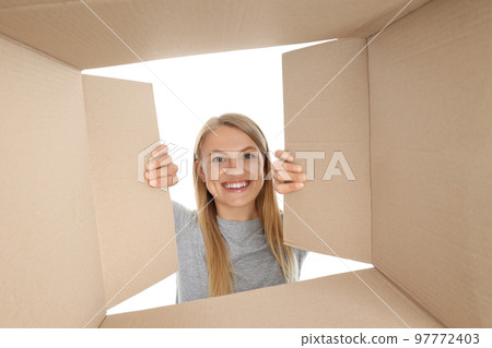 Concept of delivery, young woman look in to box, isolated on white background Concept of delivery, young woman look in to box, isolated on white background 97772403