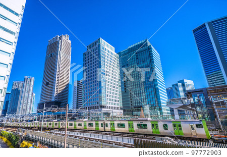 Tokyo cityscape in Japan View of Yamanote Line and skyscrapers from in front of Hamamatsucho Station (North Exit) 97772903