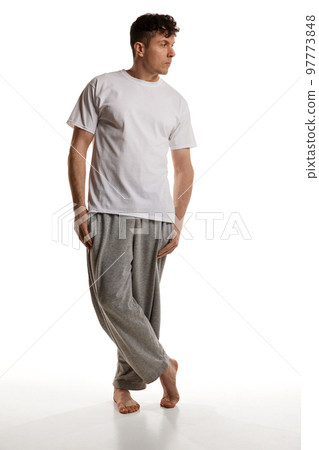 Mature man posing in shirt and pants over white studio background. Comfortable homewear. Casual look. Relaxed. Men's health and beauty 97773848